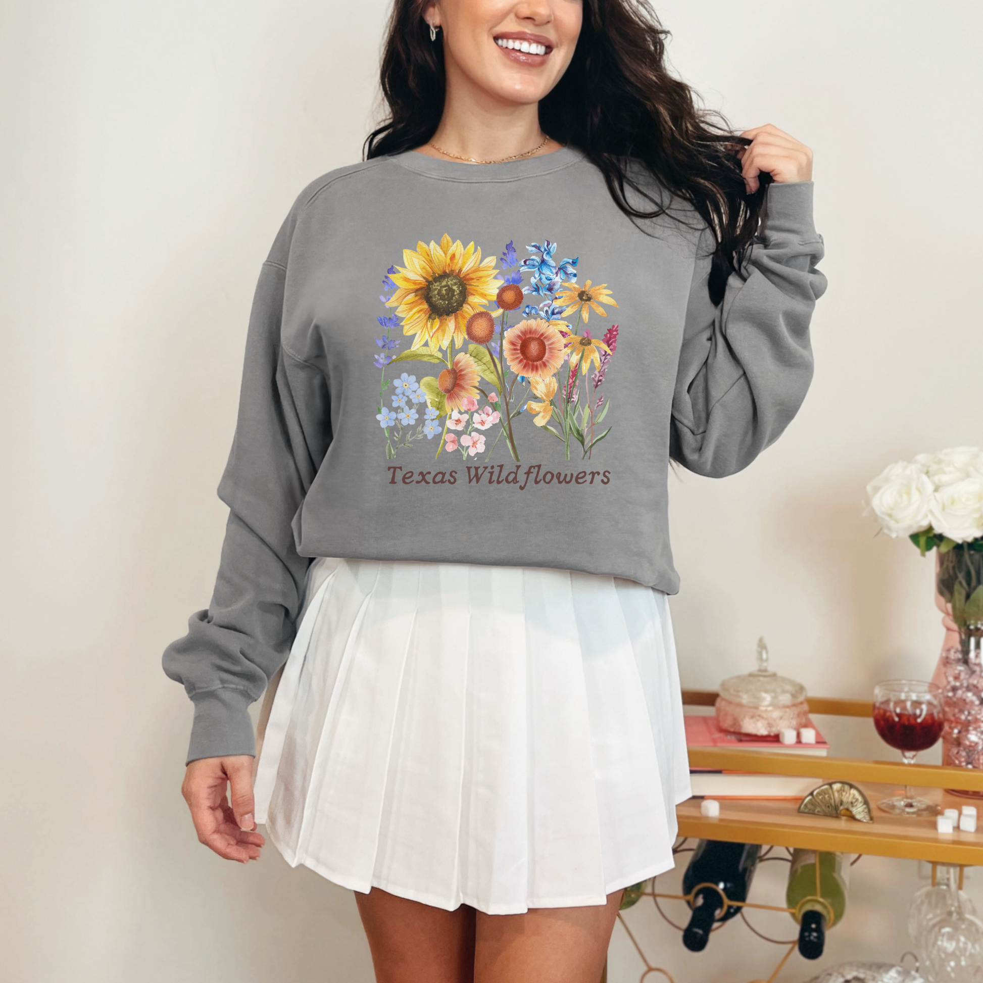 Cozy Texas Wildflowers crewneck sweatshirt designed with blooming bluebonnets and wildflowers, perfect for spring weather and soft layering. This pastel floral pullover blends Southern charm with cottagecore style, ideal for women who adore wildflower fields, Texas pride, and breathable comfort fleece. A must-have floral top for outdoor adventures, nature lovers, or soft girl fashion fans.