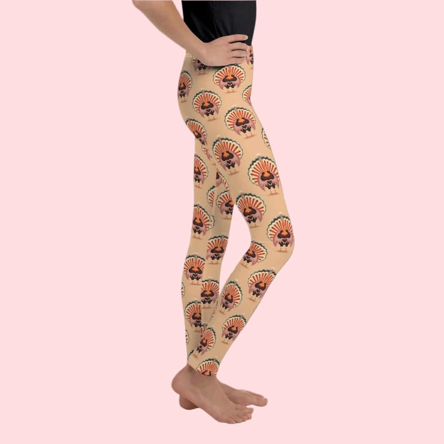Thanksgiving Turkey Love child leggings. These girls yoga pants are peach, and have a repeating pattern of turkeys showing the love sign with their hands. These girls child tights make a great gift, or a family matching outfit for the Turkey Trot! by jaecrece