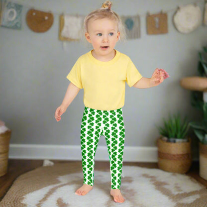 Image: St Patricks Day Leggings for toddlers and girls. Make St. Patrick’s Day extra cute with these high-rise girls’ leggings featuring a fun shamrock pattern on a white background. Available in toddler and child sizes 2T to 7, they’re made from a soft, stretchy blend with full-length legs perfect for twirling, playing, or celebrating Irish pride. Pair them with matching family styles.. Also available in tween girl and womens sizes for family matching outfits, by jaecrece