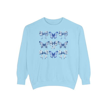 Image: Elegant yet comfortable sweatshirt for women with blue toile butterflies and bows, blending classic charm with modern softness. Sized XS to XL and designed for matching with toddlers and girls, this sweatshirt brings Texas coquette and coastal cowgirl fashion into the family wardrobe. A must-have for casual spring days, by jaecrece.
