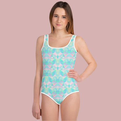 Bright geometric shapes in teal blue, lavender purple, and soft pink give this girls one piece swimsuit a fresh and artistic look. Sized from 2T through 20, it is designed for growing girls who love colorful summer fashion. As part of a matching family swimwear collection, it is perfect for creating coordinated beach photos, vacation memories, sibling matching outfits, and thoughtful gifts for birthdays, holidays, or special trips.