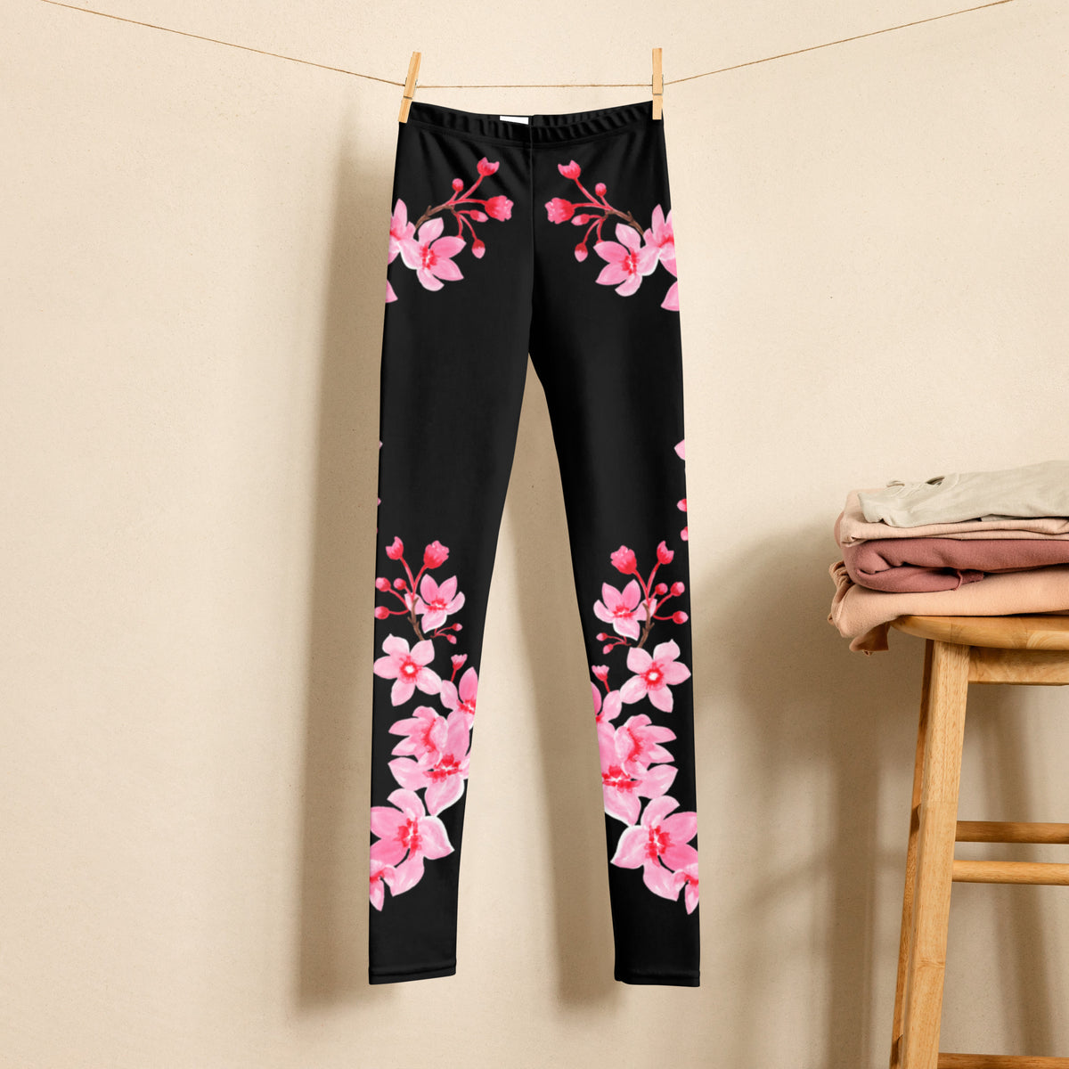 Tween and teen cherry blossom leggings featuring delicate pink sakura flowers and graceful flowering branches across a black background. These full length high rise floral leggings have a feminine Japanese inspired aesthetic and comfortable stretch, making them an easy choice for school outfits, spring fashion, casual weekends, travel, sightseeing, family outings, and everyday wear.