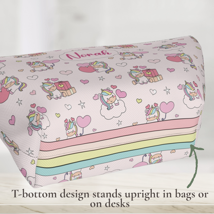 Personalized unicorn zipper pouch showing the T bottom design that helps the bag stand upright. The pastel rainbow unicorn pouch has a whimsical cutecore aesthetic and custom name personalization, making it a cute girls makeup bag, toiletry pouch, pencil pouch or travel accessory.