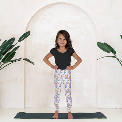 Kawaii girls leggings with mermaid and unicorn print in pastel colors on a pink base, designed for toddlers and young girls who love fun and magical clothing. High rise waistband and ankle length fit provide comfort for all day wear. Soft stretchy fabric moves easily with active kids during school, playdates, or lounging at home. A cute everyday outfit option inspired by fantasy themes, perfect for playful and imaginative kids fashion.