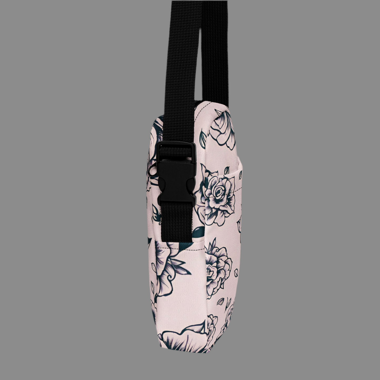 Unique pink tattoo rose print utility crossbody bag, designed for women who love alternative and gothic fashion with practical details. Made from durable polyester with sturdy backing, this bag features multiple compartments, water-resistant protection, adjustable strap, and smooth zipper closure. A stylish floral crossbody purse for concerts, festivals, travel, or daily errands, blending edgy tattoo-inspired design with function.