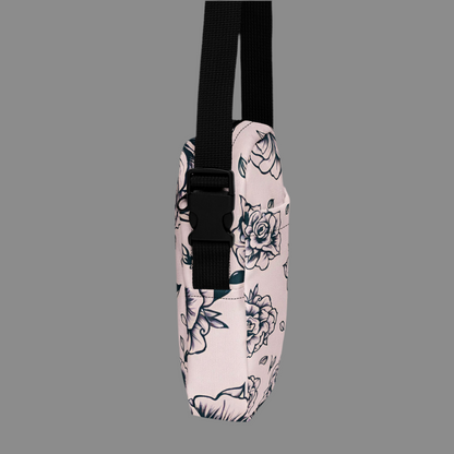 Unique pink tattoo rose print utility crossbody bag, designed for women who love alternative and gothic fashion with practical details. Made from durable polyester with sturdy backing, this bag features multiple compartments, water-resistant protection, adjustable strap, and smooth zipper closure. A stylish floral crossbody purse for concerts, festivals, travel, or daily errands, blending edgy tattoo-inspired design with function.