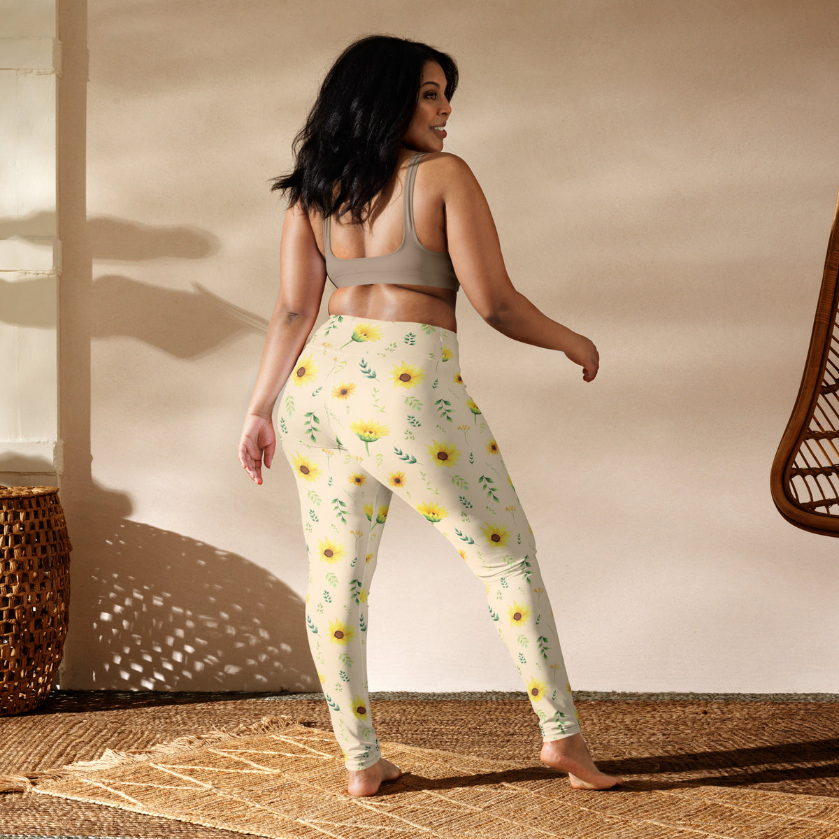 Sunflower leggings featuring a vintage botanical inspired print with yellow flowers and delicate green foliage scattered across a soft cream background. The illustrated style gives the design a nostalgic garden feel without being overly bold. These women's full length leggings are easy to dress up or down and can be worn for casual days, outdoor activities, yoga, walking, travel, or relaxed cottagecore inspired outfits.