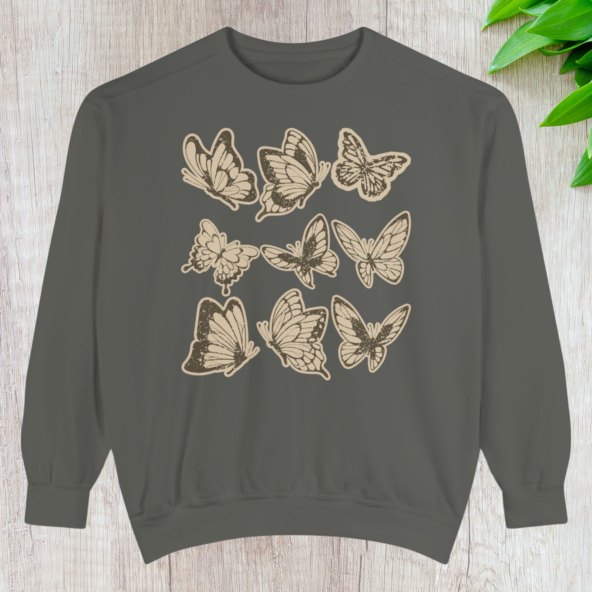 Vintage butterfly Comfort Colors crewneck sweatshirt in Pepper grey with hand-drawn butterfly artwork inspired by vintage botanical journals. This oversized, unisex sweatshirt blends soft girl, cottagecore, coquette, and naturecore aesthetics for a cozy, nostalgic vibe. Perfect for mamas, garden lovers, and everyday wear through fall, winter, and spring. Comfortable cotton blend, OEKO-TEX dyes, ideal butterfly lover gift, casual cozy style.