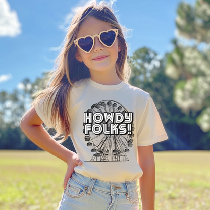 Vintage carnival youth graphic tee featuring a Ferris wheel illustration and bold HOWDY FOLKS lettering. This nostalgic fair shirt is perfect for kids attending the State Fair of Texas, county fairs, fall festivals, and family events. The colorful retro design brings classic fairground style to an everyday outfit and pairs with the matching adult shirt for a fun coordinated family look.