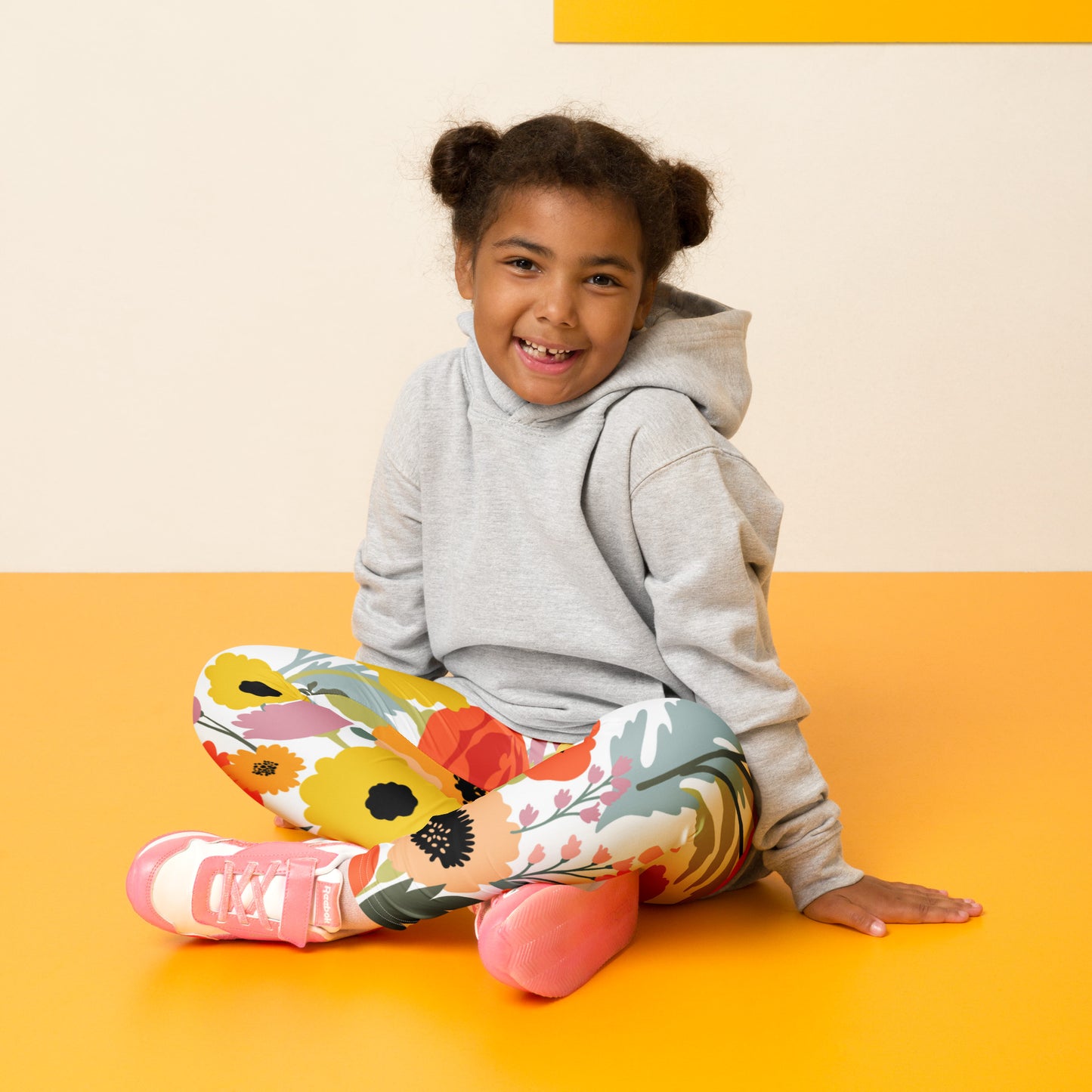 Image: Vibrant watercolor floral leggings for toddlers, available in sizes 2T to 7. These leggings feature a delicate print of pinks, yellows, and greens on a bright white background, capturing the beauty of springtime blooms. Made for comfort and movement, they’re ideal for everyday adventures. Match with coordinating girls and women’s leggings for a sweet family photo look, by jaecrece.