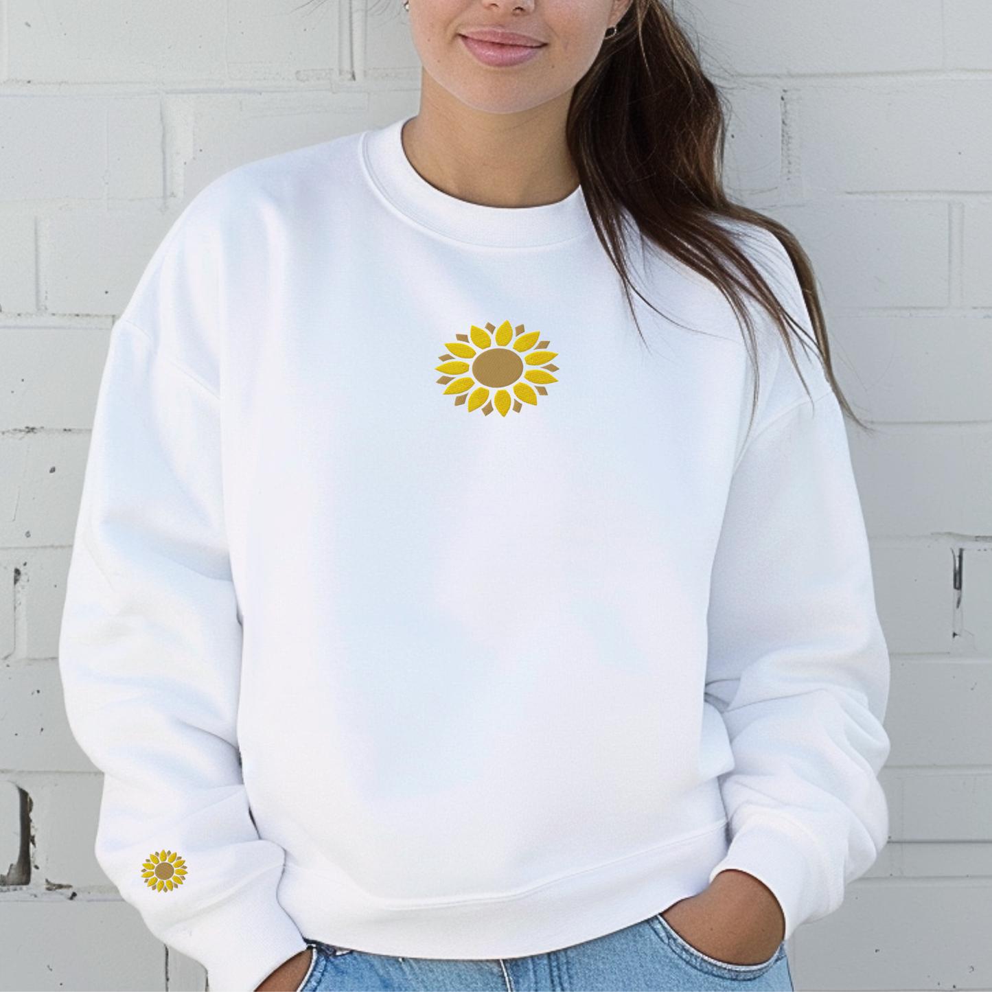 White Comfort Colors embroidered sweatshirt with sunflower designs stitched on both the center chest and right wrist. The clean neutral color highlights the detailed floral embroidery while maintaining a versatile look. This relaxed fit crewneck offers comfort and style for flower lovers, gardeners, teachers, moms, and anyone looking for a cozy botanical inspired sweatshirt.