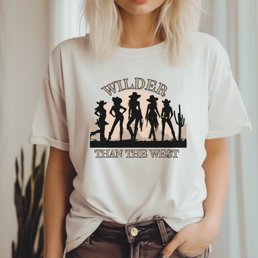Wilder than the West Shirt in soft Natural color, this tee boasts five striking cowgirl silhouettes in a cactus-studded desert. It’s a Western Cowgirl Silhouette Tee in Mommy and Me Sizes for Toddlers, Girls & Women. Ideal for a state Texas coquette bachelorette trip, southern fairs, or music festival rodeo fun. This country girl shirt offers Graphic Wear Women love for its ride-ready quote kids look and coastal badass style with a mommy and me match twist.