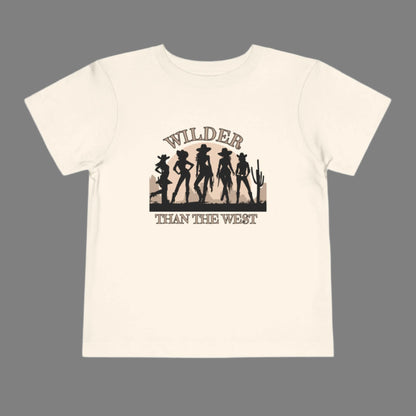 Wilder than the West toddler tee with a bold cowgirl graphic is perfect for girls who love rodeo rides and dusty trails. Designed in soft natural, this western silhouette shirt for toddlers pairs effortlessly in mama mini sets for festivals, birthdays, or Texas fair events. A comfy toddler country girl shirt with vintage vibes and a strong western quote—great for southern babes and little cowgirls in training.