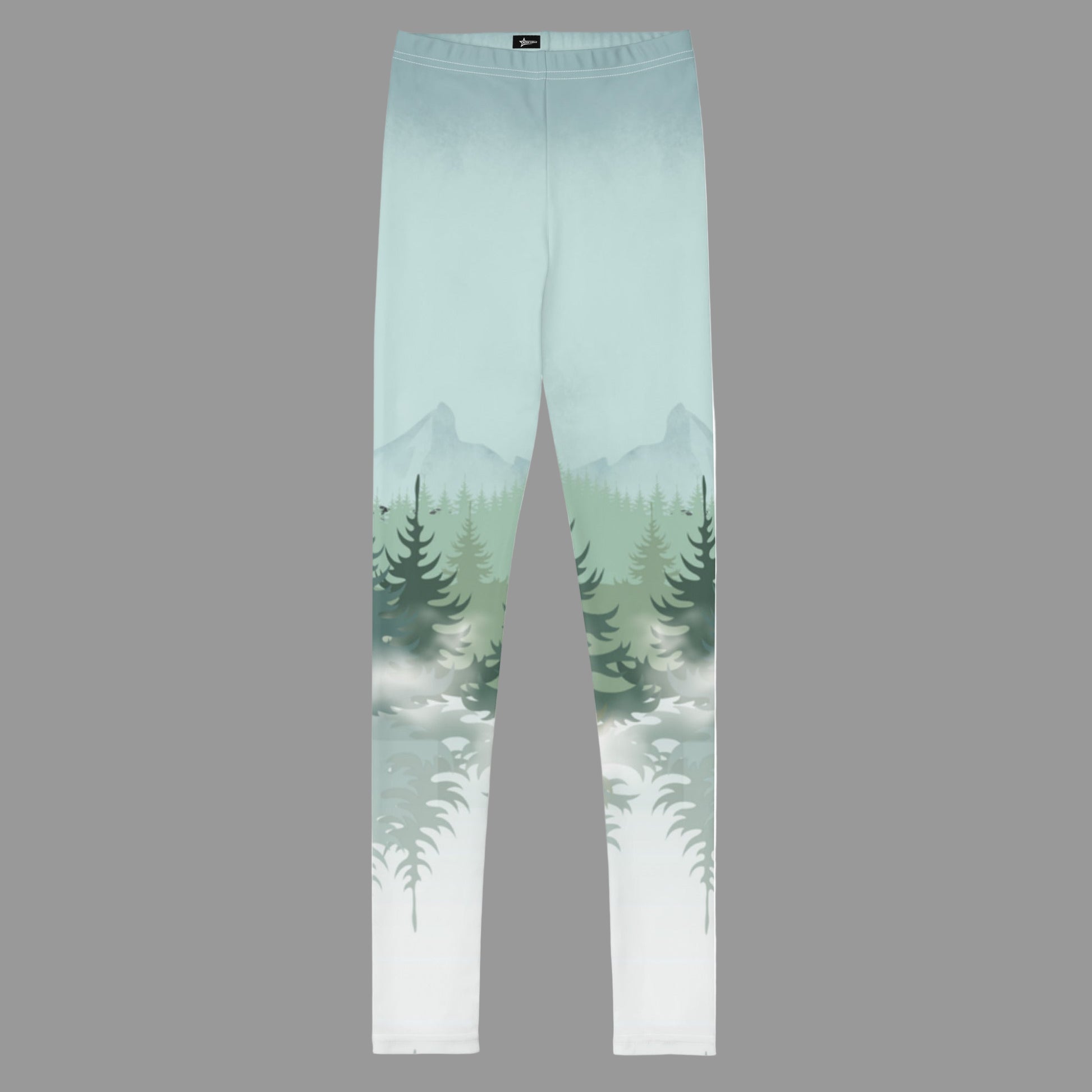 Winter Forest Kids Leggings in sizes 8–20 with nature-inspired snowy mountain and pine tree graphics. Part of a family matching activewear collection, perfect for winter holiday outfits, ski lodge vacations, cozy après-ski days, outdoor adventures, and family photos. Soft microfiber yarn with four-way stretch and durable overlock stitching. Made-to-order eco-friendly leggings for stylish, coordinated family winter looks.