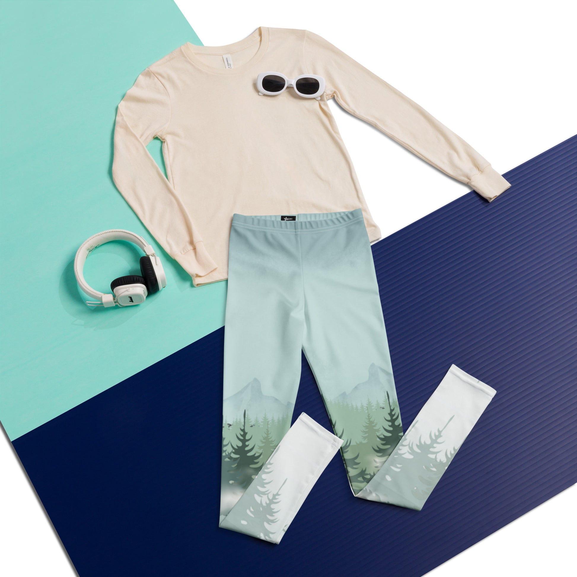 Winter Forest Youth Leggings featuring a snowy mountain and pine tree print, perfect for boys and girls in sizes 8–20. Part of a family matching activewear collection, ideal for ski lodge trips, winter vacation outfits, cozy après-ski lounging, outdoor adventures, and holiday photos. Soft microfiber yarn with four-way stretch for comfort, durability, and all-day play. Eco-friendly, made-to-order leggings for stylish family matching looks.