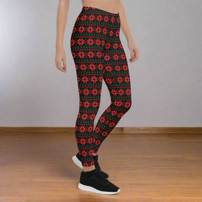 Holiday leggings for women with a black base and red and green poinsettia print in a fair isle geometric aesthetic. Designed with a mid rise waist and full length to the ankle, these leggings are soft, stretchy, and perfect for Christmas outfits, cozy winter days, and festive events. A great choice for matching family outfits, mommy and me style, and shoppers searching for cute Christmas leggings.