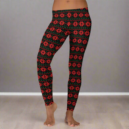 Women’s festive leggings with a black background and geometric poinsettia print in red and green, inspired by classic fair isle patterns. Mid rise fit and full length silhouette provide comfort and style for holiday parties, cozy nights, and everyday winter wear. Perfect for matching mommy and me outfits, family Christmas photos, and shoppers looking for unique holiday leggings with a floral twist.