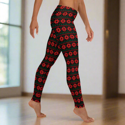 Festive women’s leggings featuring red and green poinsettia print on a black background in a fair isle inspired geometric pattern. Designed with a mid rise waist and full length fit to the ankle, these leggings are soft, stretchy, and perfect for Christmas outfits, winter lounging, and family gatherings. Ideal for matching family outfits and holiday photos.