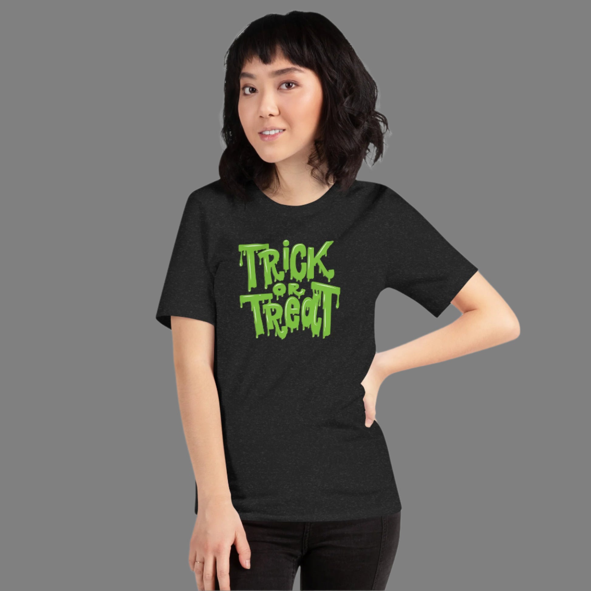 Soft unisex Halloween shirt with Trick or Treat printed in oozing green slime. A perfect mix of humor and horror, this Halloween tee adds bold style to your spooky season. Whether you’re handing out candy or attending a haunted event, this shirt is comfy, festive, and available in inclusive sizes XS through 5XL.