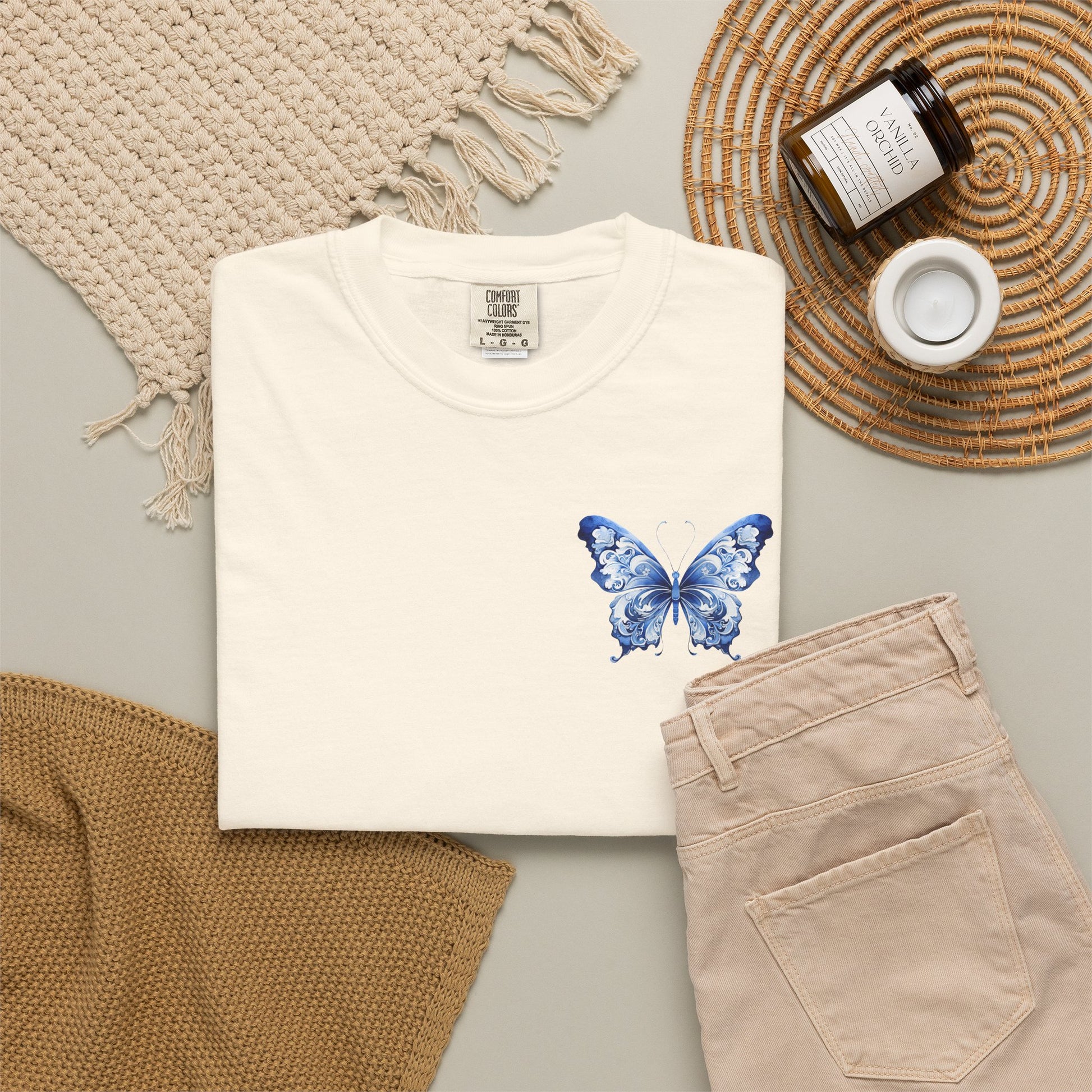 Women’s boutique butterfly t shirt made on a Comfort Colors 1717 blank featuring a blue toile butterfly left chest print. Available in five colors and inclusive sizes S through 4XL. This relaxed garment dyed tee brings together French countryside style, cottagecore charm, and quiet luxury fashion trends. A beautiful casual shirt for travel days, teacher outfits, brunch looks, gifts, and everyday soft cotton comfort.