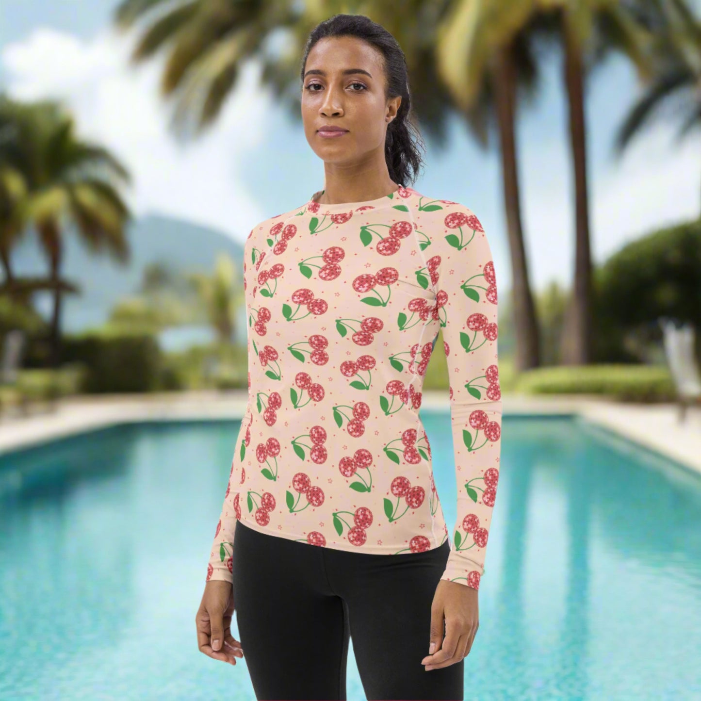 Women’s retro cherry swimwear top showcasing a fun colorful print, soft four way stretch material, and long sleeve coverage for stylish sun protection during summer adventures.