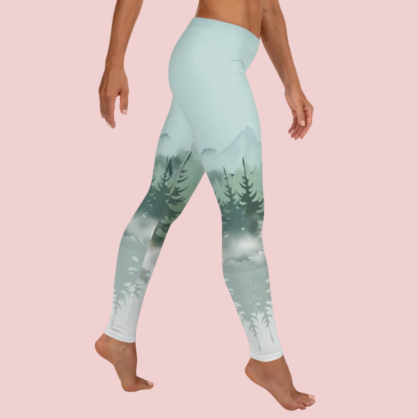 Women’s winter forest leggings with a mid rise waist and full length fit, featuring a snowy pine forest scene in ombre shades of green, blue, and gray. Perfect for Apres Ski outfits, cozy winter wear, nature inspired fashion, and casual or outdoor adventures. These leggings are ideal for gifts, women who love forest vibes, winter scenery, and comfortable stylish all day wear.