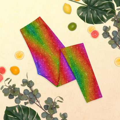 Colorful women's leggings with a holographic swirl pattern that mimics glitter and rainbow lights. Designed for festival outfits, Pride events, or running gear with flair, these full-length leggings combine fun and function. The mid-rise fit and four-way stretch make them perfect for dancing, walking, or everyday wear. Matching toddler and youth sizes available for coordinated family fashion moments.