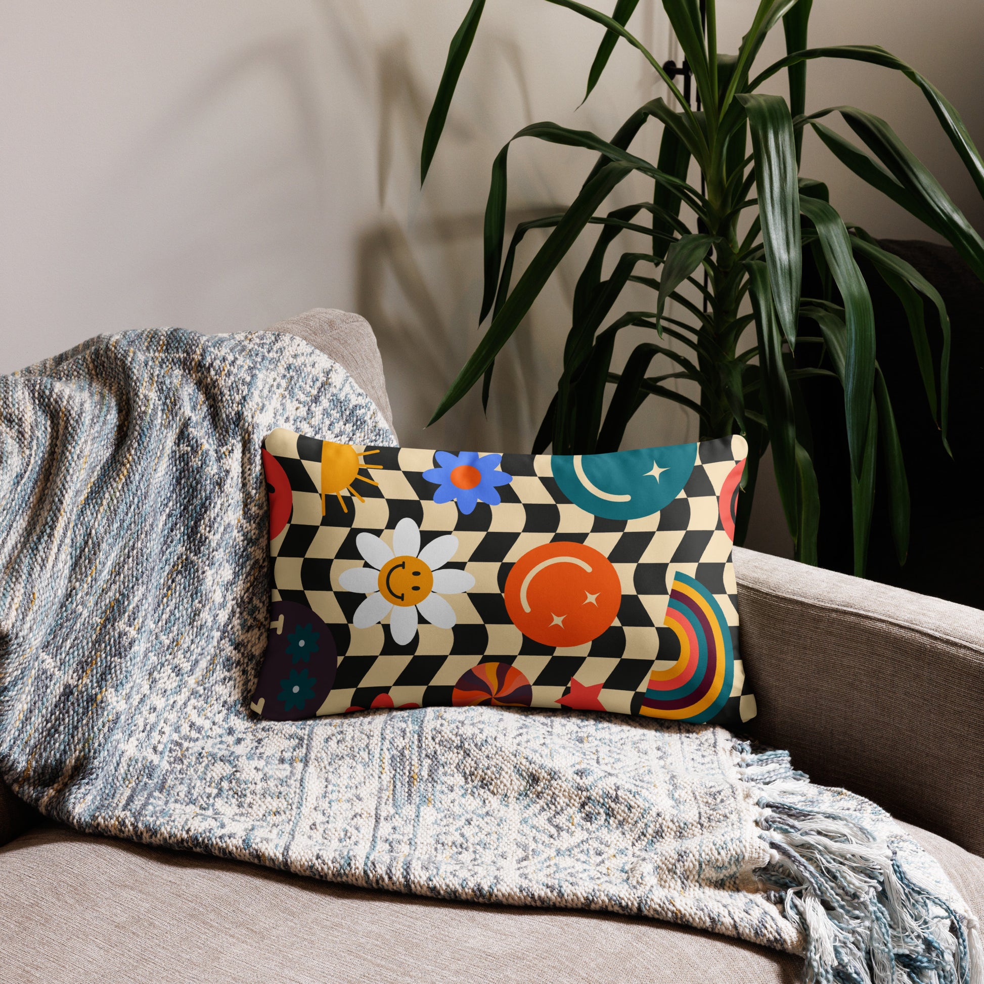 Rectangular Y2K smiley face checkerboard throw pillow styled on a cozy couch with a soft throw blanket, showing how this playful accent adds personality and cheerful energy to living rooms, teen bedrooms, or dorm lounges. Retro black and tan check pattern with bright smiley icons brings soft girl aesthetic and nostalgic Y2K vibes. Perfect decorative pillow for gifting, room makeovers, and stylish cozy home décor that combines comfort and fun.