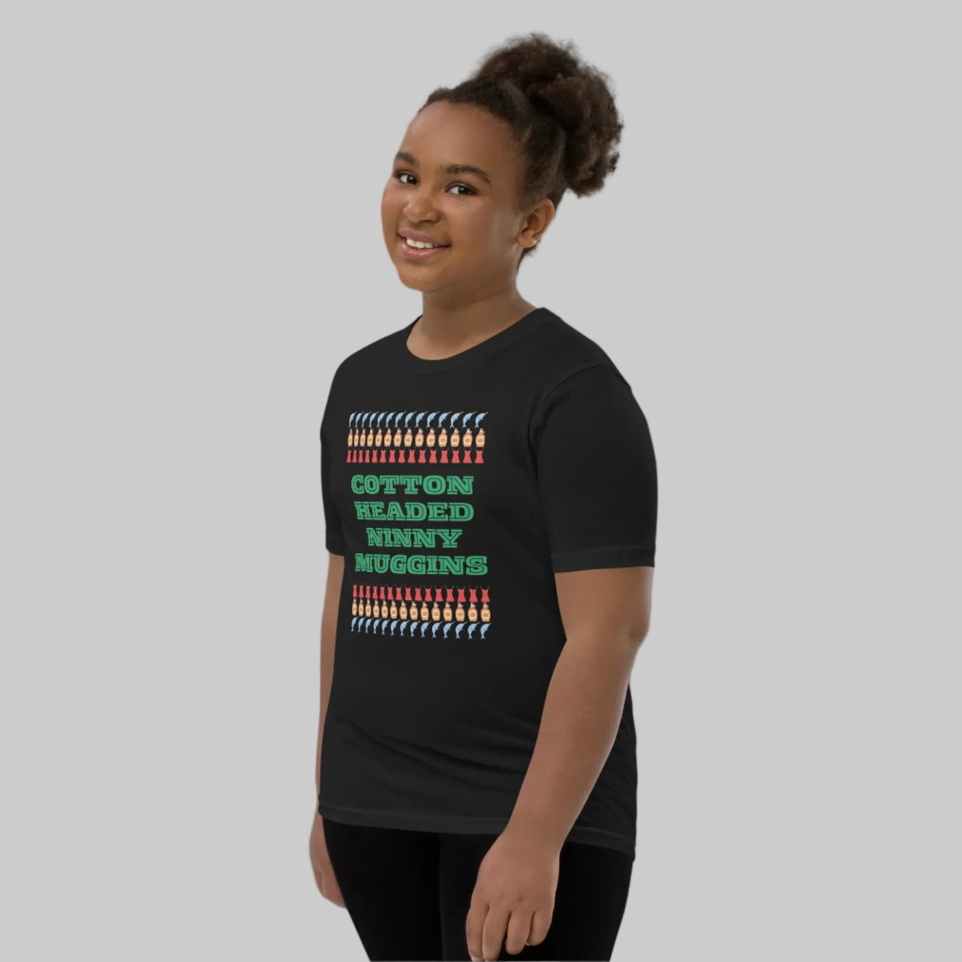 Fun and festive youth t-shirt featuring “Cotton Headed Ninny Muggins” from the Elf movie. Made from soft, breathable cotton with a relaxed fit, this kids’ holiday tee is perfect for Christmas parties, school holiday events, or cozy winter days. Pre-shrunk fabric keeps the tee fitting perfectly wash after wash. A playful gift for boys and girls who love Christmas humor.