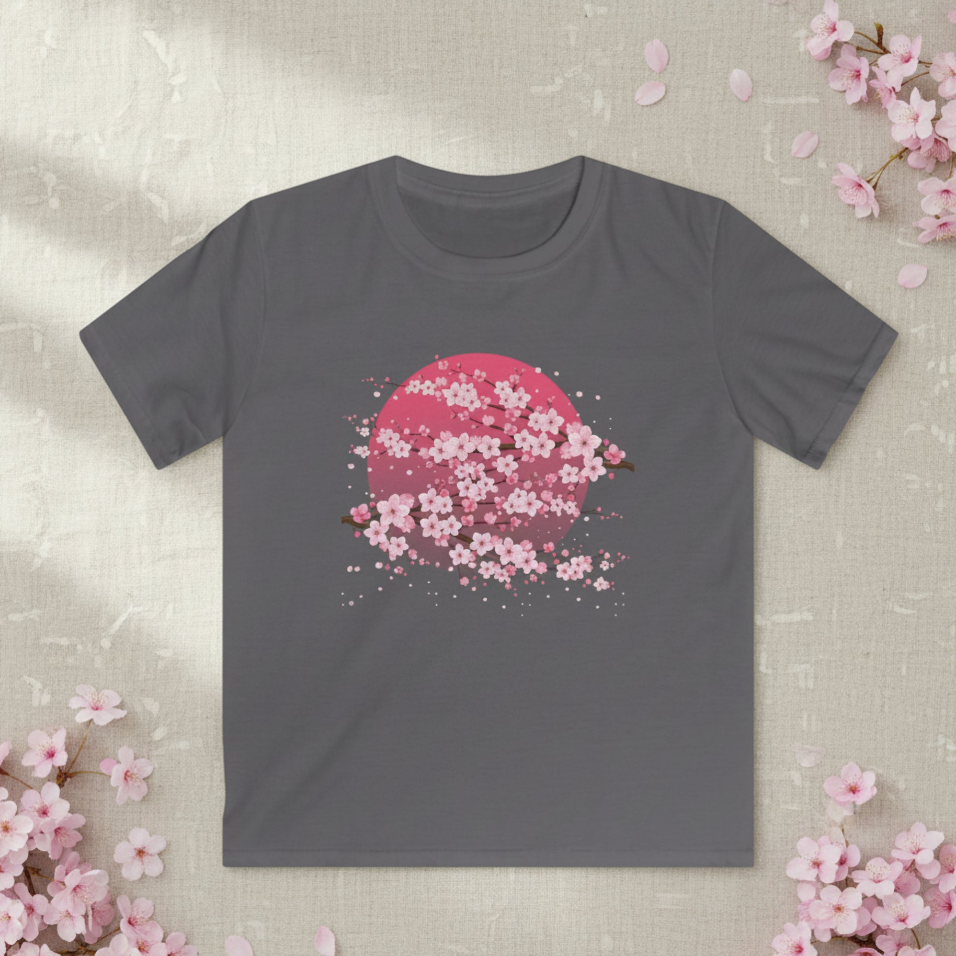 Youth cherry blossom graphic t shirt featuring delicate pink sakura blossoms and a moon inspired design. This Japanese inspired floral tee is made for kids who love artistic, nature inspired, and cute graphic shirts.