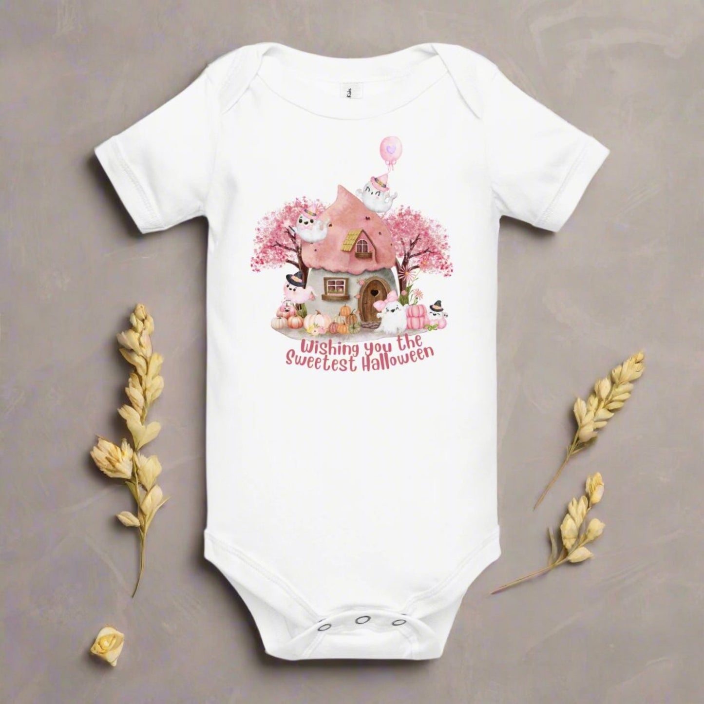 Image: Celebrate baby's first Halloween in pastel style with this adorable pink ghost bodysuit featuring pink pumpkins, whimsical cottage artwork, and fall baby fashion details. Designed for comfort and festive fun, this infant outfit is perfect for trick-or-treat events, baby photo shoots, or Halloween gifts for newborn girls, by jaecrece.

