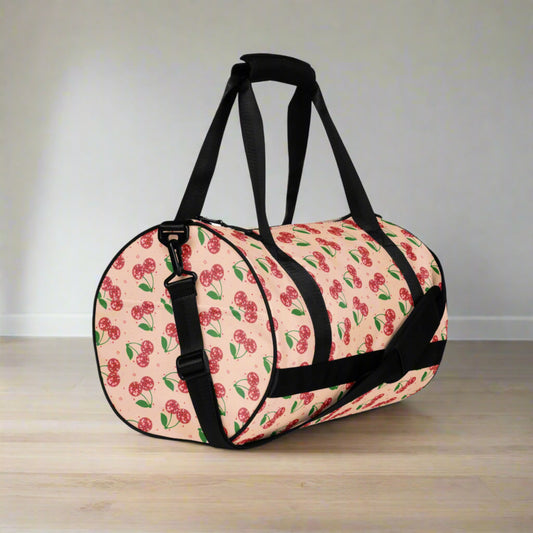 Disco Cherry Gym Bag. This pink athletic duffel bag features a red cherry mirror ball pattern with stars. The perfect bag for overnight trips, Bachelorette parties, or a gift for your favorite teen or tween dancer, by jaecrece