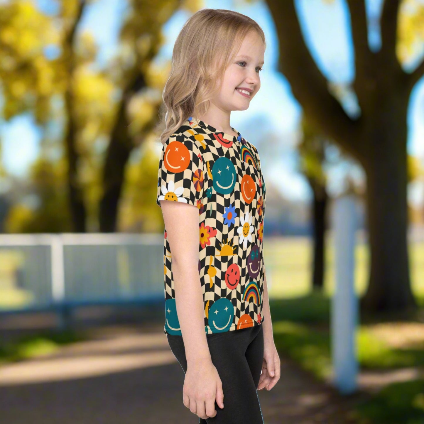 Smiley Face Checkerboard Kids Crew Neck T-Shirt Smiley Face Checkerboard Girls Leggings. This cute retro shirt features a black and khaki checkerboard background, with smiley face, rainbow and daisy graphics. In toddler, and girls sizes. by jaecrece.com Size 2T-7 - jaecrece