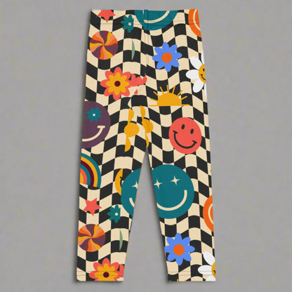 Image: Retro Checkerboard Girls Leggings, in size 2T-7. These toddler and kids yoga pants feature a black and khaki vintage check pattern with smiley faces, daisies, rainbows and suns. These vintage tights make a great birthday present, birthday gift, and are great for back to school, by jaecrece