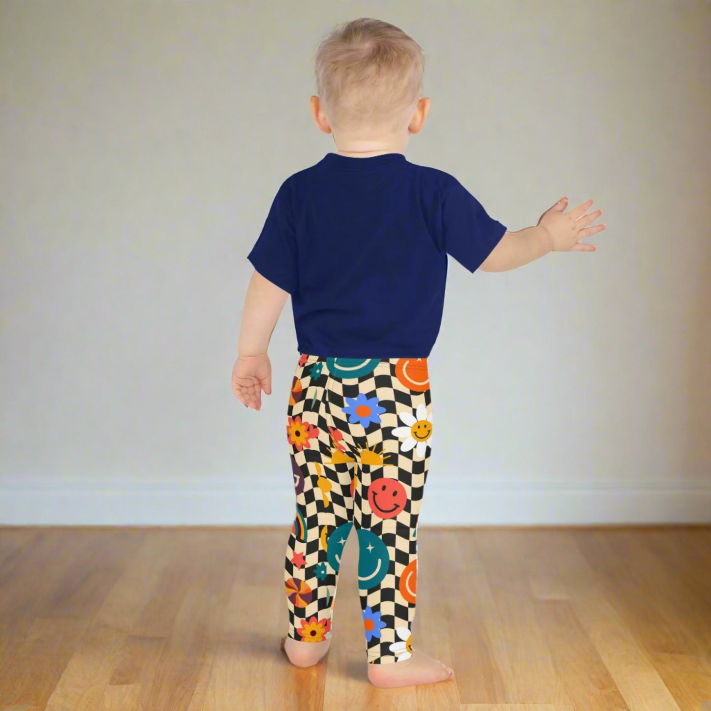 Image: Retro Checkerboard Girls Leggings, in size 2T-7. These toddler and kids yoga pants feature a black and khaki vintage check pattern with smiley faces, daisies, rainbows and suns. These vintage tights make a great birthday present, birthday gift, and are great for back to school, by jaecrece