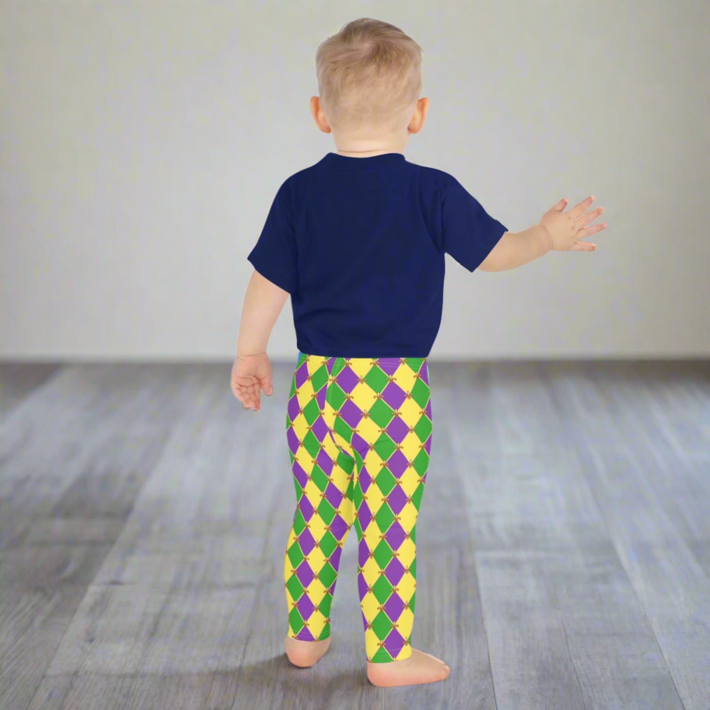 Image: Mardi Gras Kids Leggings, in sizes 2T-7. These Canival themed yoga pants feature a gold, green and purple diamond pattern with a fleur de lis accent. Perfect attire for any New Orleans French Quarter parade, by jaecrece