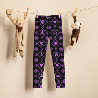 Wickedly Cute Toddler & Kids Halloween Leggings, featuring a black material with a purple geometric pattern that consists of spiders webs, pumpkins, witches hats and skulls, by jaecrece.com