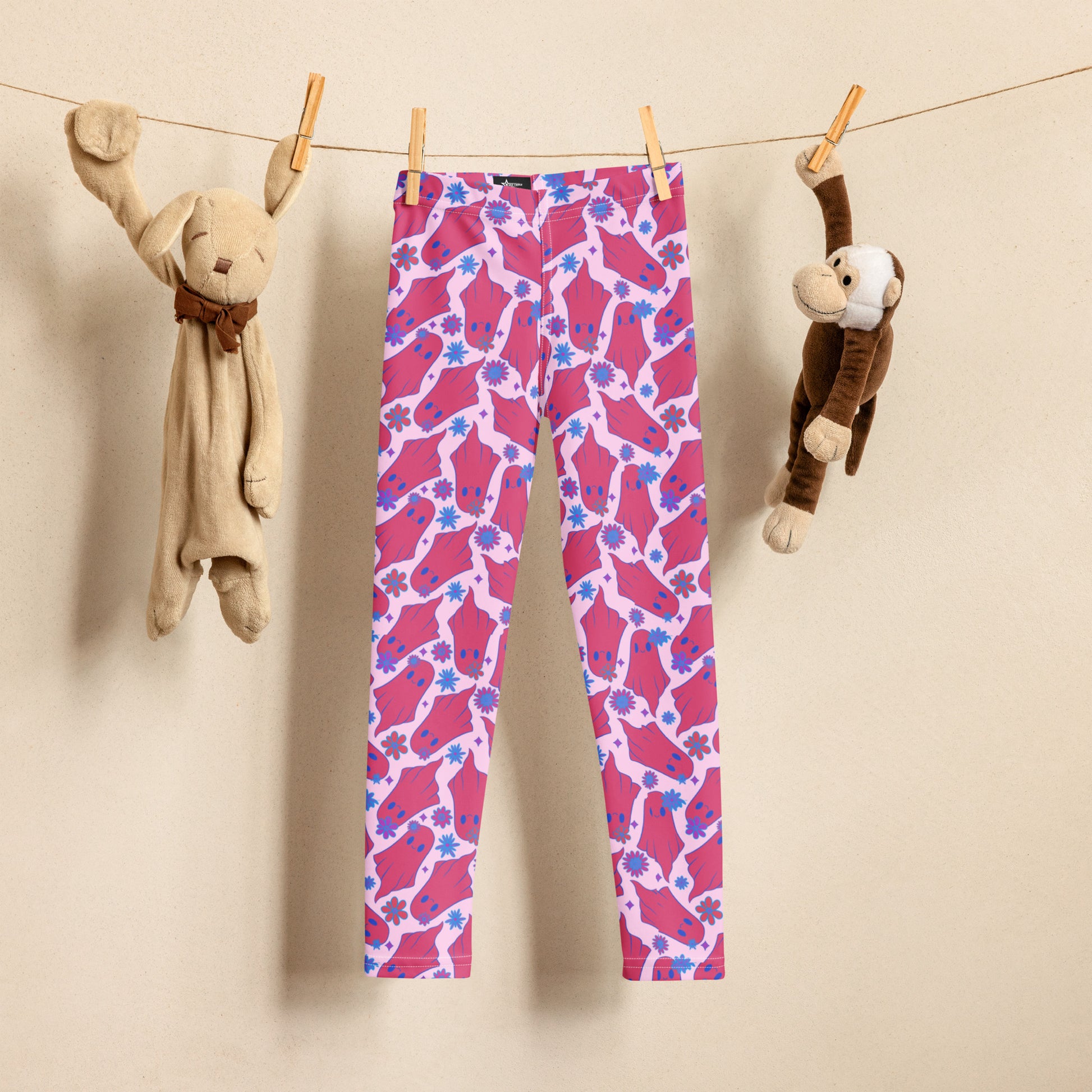 Cute Ghosts with Flowers Halloween Toddler Leggings. These kids yoga pants are light pink, with adorable hot pink ghosts with blue flowers. The perfect pants for Trick or Treating or a Spooky School outfit. Available in 2T, 3T, 4T, 5T, 6, 6X and 7, by jaecrece