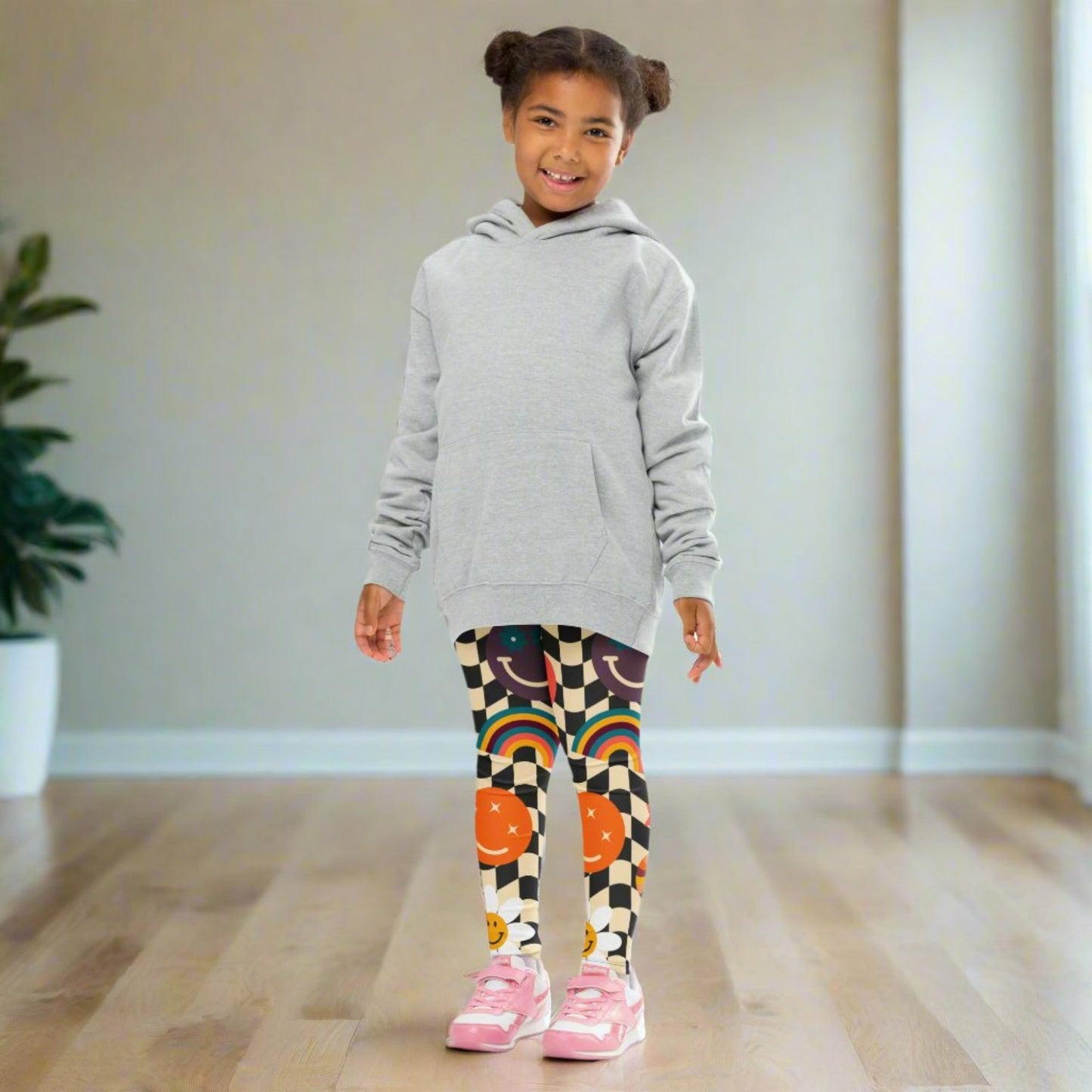 Image: Retro Checkerboard Girls Leggings, in size 2T-7. These toddler and kids yoga pants feature a black and khaki vintage check pattern with smiley faces, daisies, rainbows and suns. These vintage tights make a great birthday present, birthday gift, and are great for back to school, by jaecrece