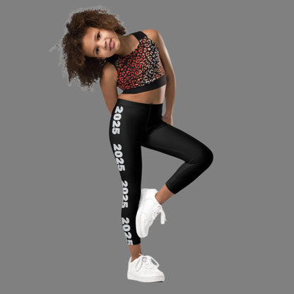 2025 Leggings for Happy New Year Party Celebration or a gift for graduating class of 2025. Black yoga pants have large repeating silver 2025 running down the outside of each leg. Tights are available in toddler and girls child sizes 2T-7, by jaecrece