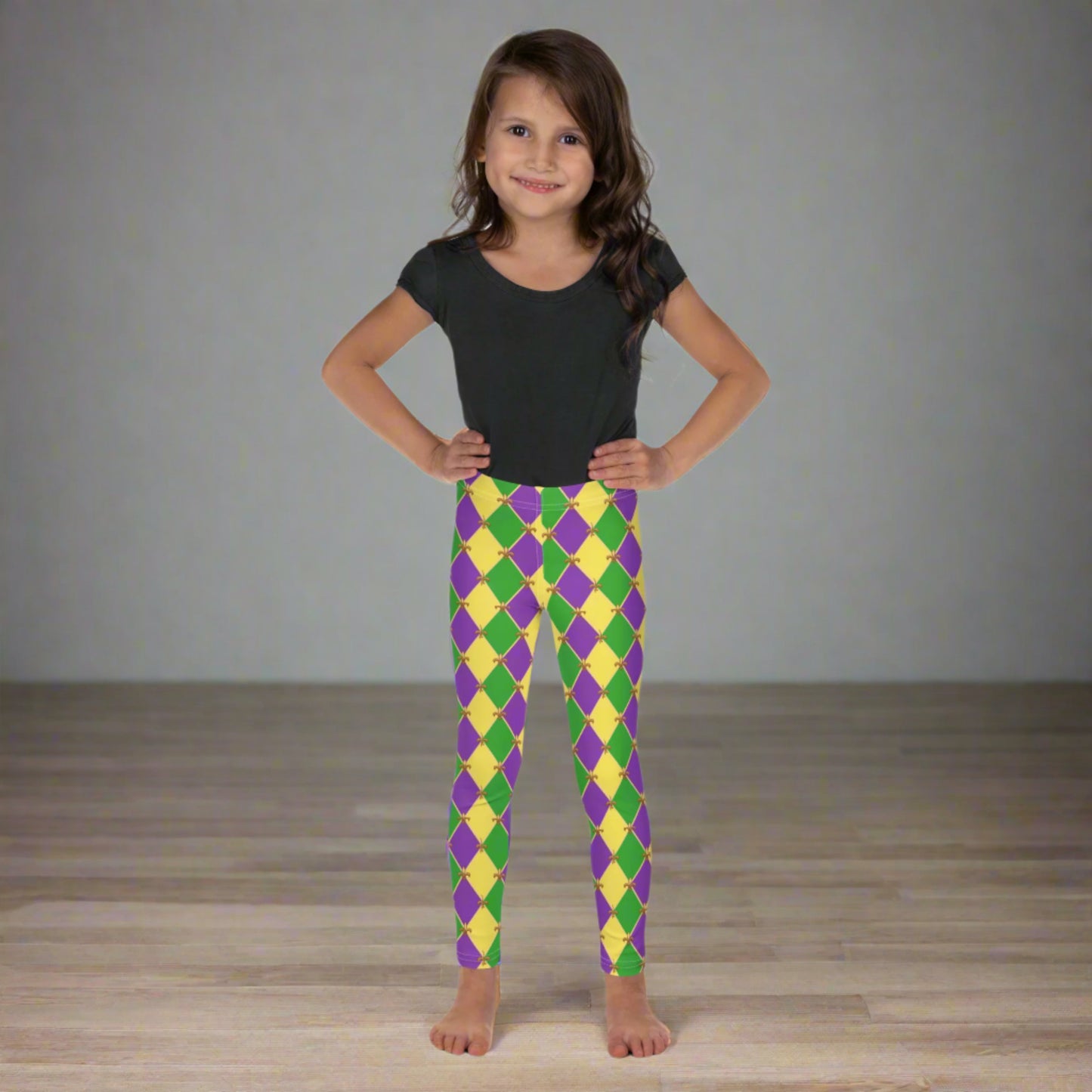 Image: Mardi Gras Kids Leggings, in sizes 2T-7. These Canival themed yoga pants feature a gold, green and purple diamond pattern with a fleur de lis accent. Perfect attire for any New Orleans French Quarter parade, by jaecrece