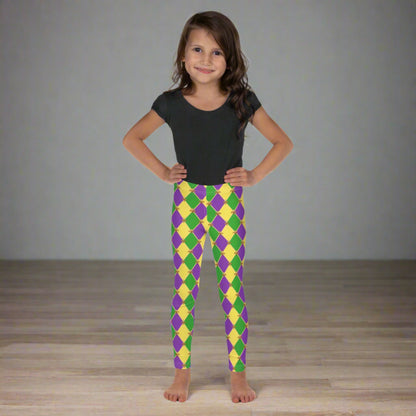 Image: Mardi Gras Kids Leggings, in sizes 2T-7. These Canival themed yoga pants feature a gold, green and purple diamond pattern with a fleur de lis accent. Perfect attire for any New Orleans French Quarter parade, by jaecrece