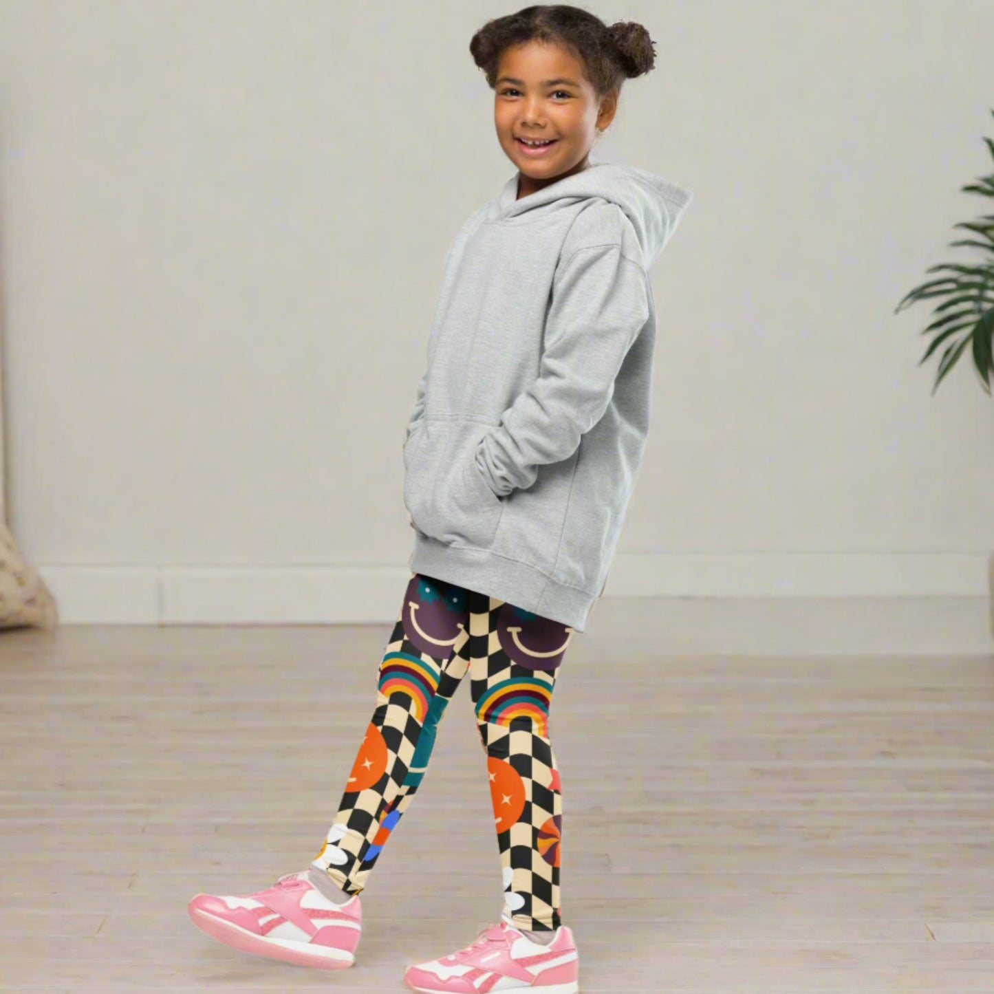 Image: Retro Checkerboard Girls Leggings, in size 2T-7. These toddler and kids yoga pants feature a black and khaki vintage check pattern with smiley faces, daisies, rainbows and suns. These vintage tights make a great birthday present, birthday gift, and are great for back to school, by jaecrece