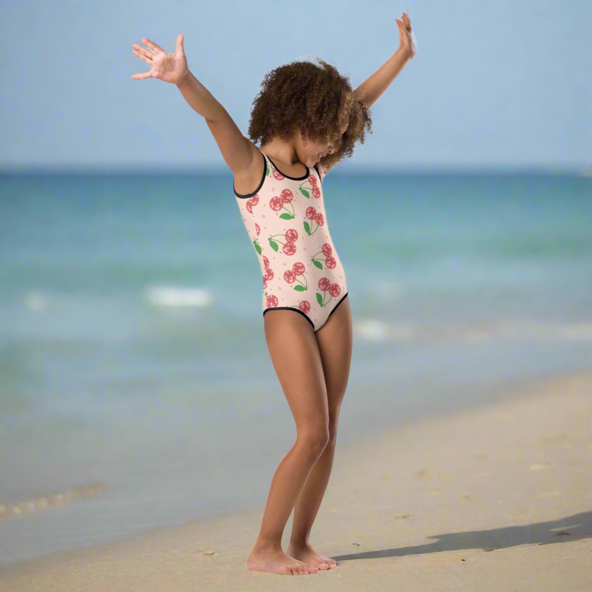 Image: Disco Cherries Kids  One Piece Swimsuit n sizes 2T-7, This fruit inspired swimsuit is a part of our Family Matching Swimwear Collection, and features a pink background with red disco ball cherries and stars, by jaecrece