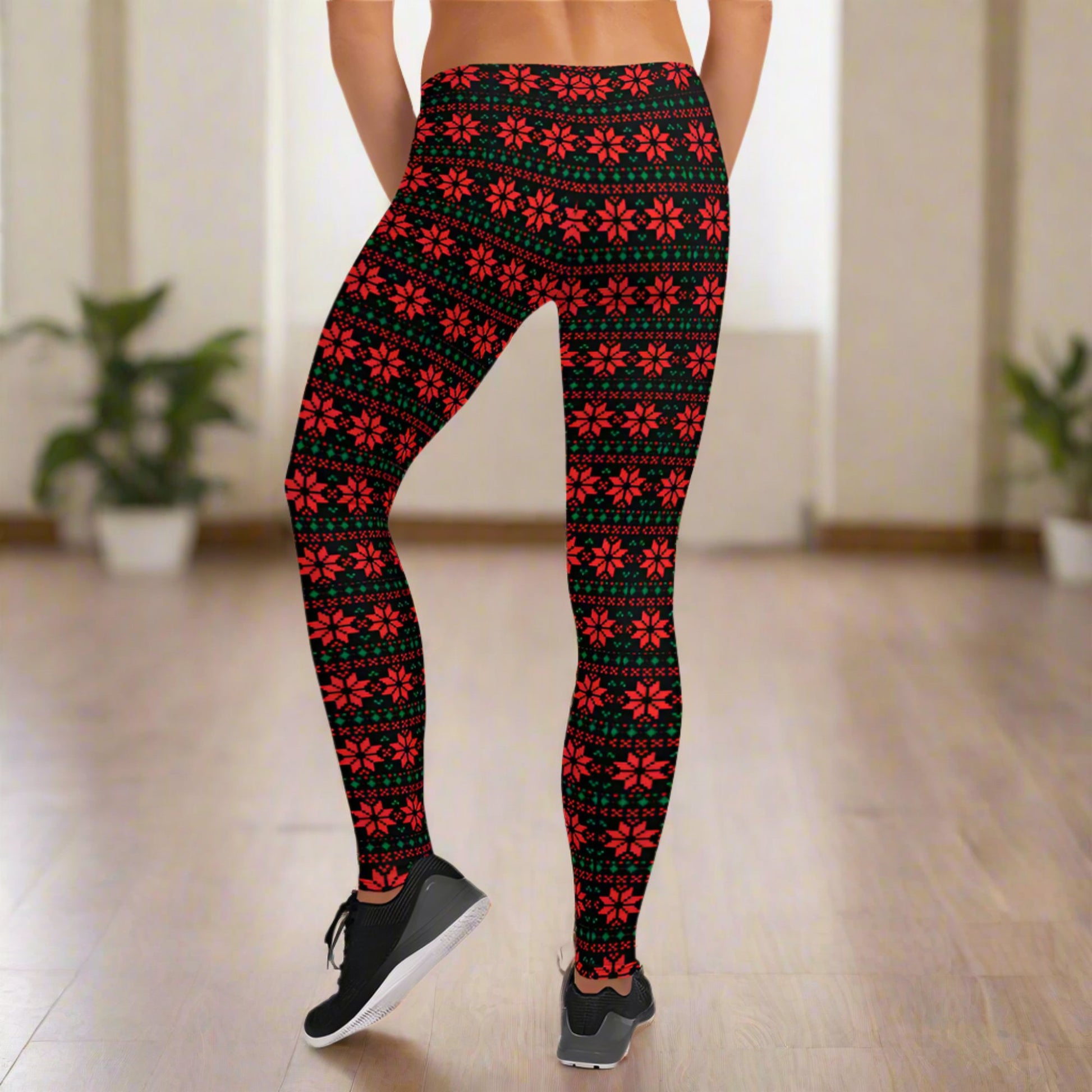 Ladies Ugly Christmas Sweater Pattern Christmas Poinsettia Leggings. These yoga pants are black with a red and green geometric floral pattern. Available in toddler, tween and teen girl sizes for Mommy and me/ Family Matching holiday options. By jaecrece