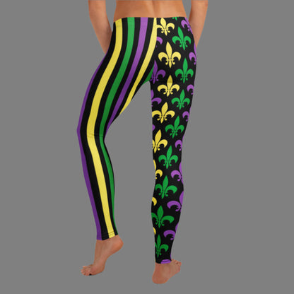 Alt text: Mardi Gras leggings for toddler girls, tweens, and women. Featuring a black background, one leg has bold gold, green, and purple stripes, while the other showcases a fleur-de-lis pattern. Perfect for celebrating New Orleans style with festive flair.