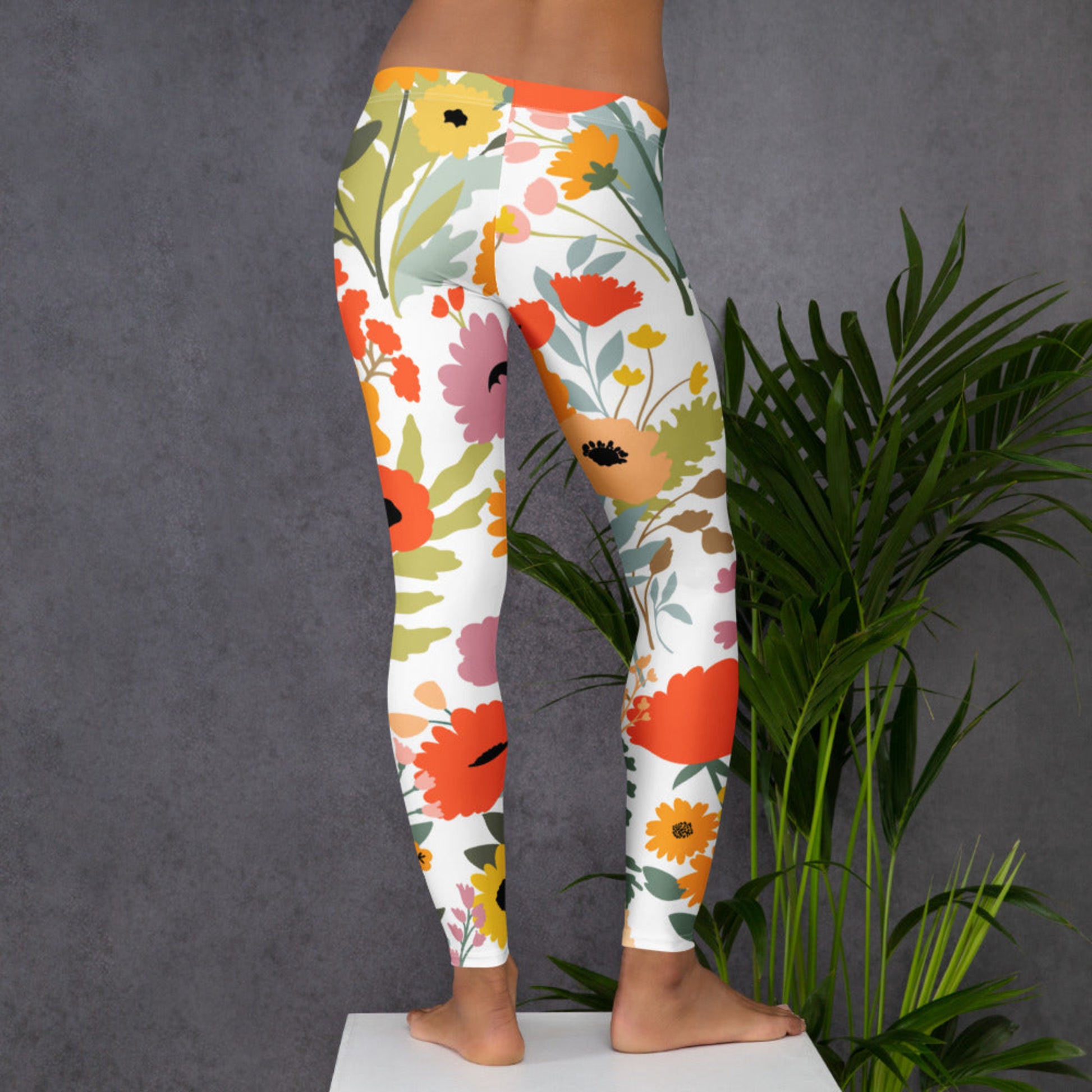 Image: Feminine Wildflower Ladies Leggings showcasing soft floral patterns and cozy stretch fabric. These comfy pants offer stylish support for women who enjoy nature themed clothing and relaxed weekend wear. Whether for springtime brunch, outdoor yoga, or simply enjoying the day at home, these leggings bring comfort and charm in sizes XS through XL, by jaecrece.