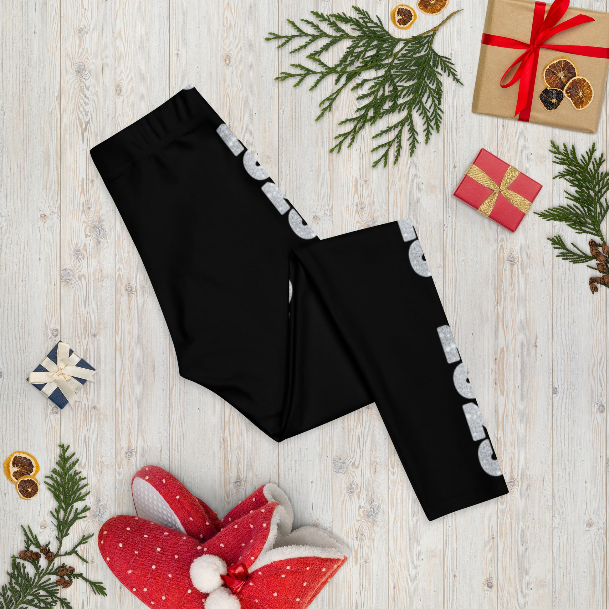 2025 Leggings for Happy New Year Party Celebration or a gift for graduating class of 2025. Black yoga pants have large repeating silver 2025 running down the outside of each leg. Tights are available in women / ladies sizes XS-XL, by jaecrece