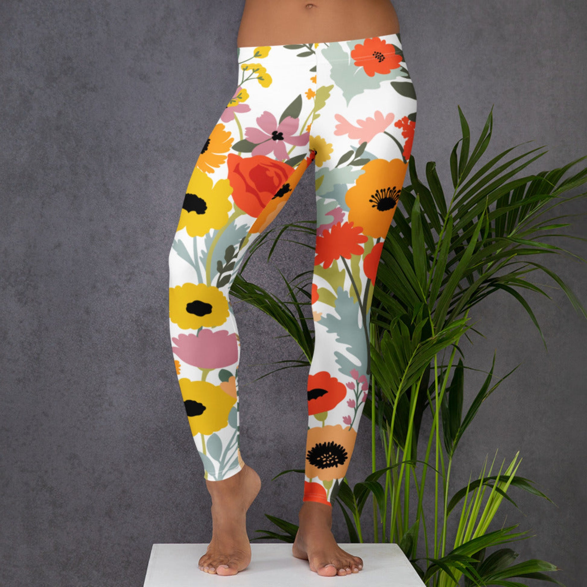 Image: Soft and stylish Wildflower Ladies Leggings featuring a delicate floral pattern inspired by blooming fields. Designed for women who love feminine activewear, these leggings offer a comfortable fit with stretchy fabric perfect for yoga, errands, or lounging. Ideal for cottagecore lovers and nature fans, these floral leggings in sizes XS to XL blend comfort with botanical charm for everyday wear, by jaecrece.

