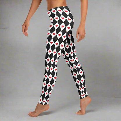 Image: Harlequin Love Ladies Leggings. These yoga tights have a black and white checker/ diamond pattern with a red heart accent, the perfect leggings for valentines day or a Queen of Hearts costume, by jaecrece